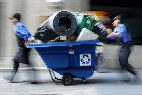 Staff conducting commercial waste collection with safety gear
